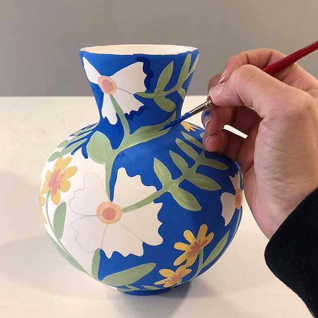Learn how to paint flowers on pottery